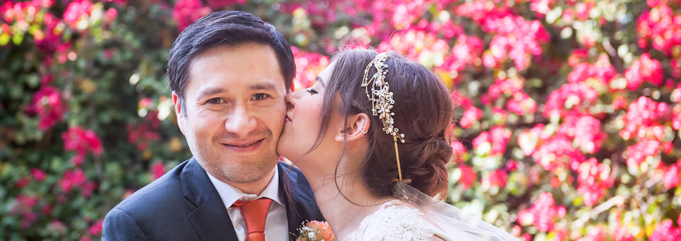 bride kisses groom captured by Cancun wedding photographer, dorota Jamal